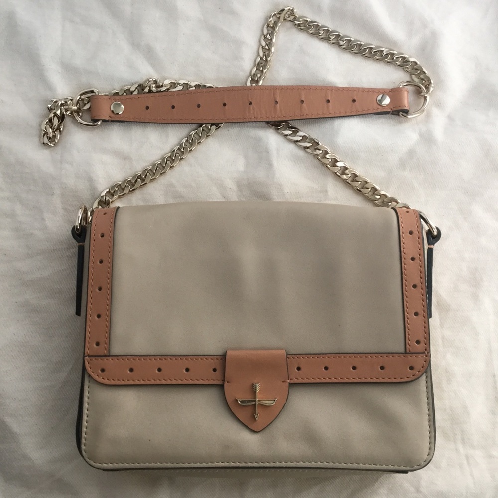 Pour La Victoire beige and tan cross-body bag.